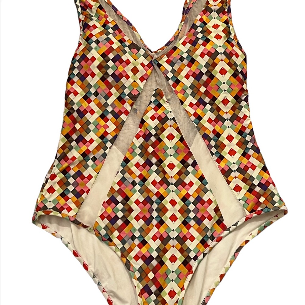 Saha sexy swimsuit.  Covered but not with netting accents. Luxury at the beach.